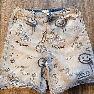 Easel Distressed Jean Shorts with Black Graffiti Print and Pastel Accents